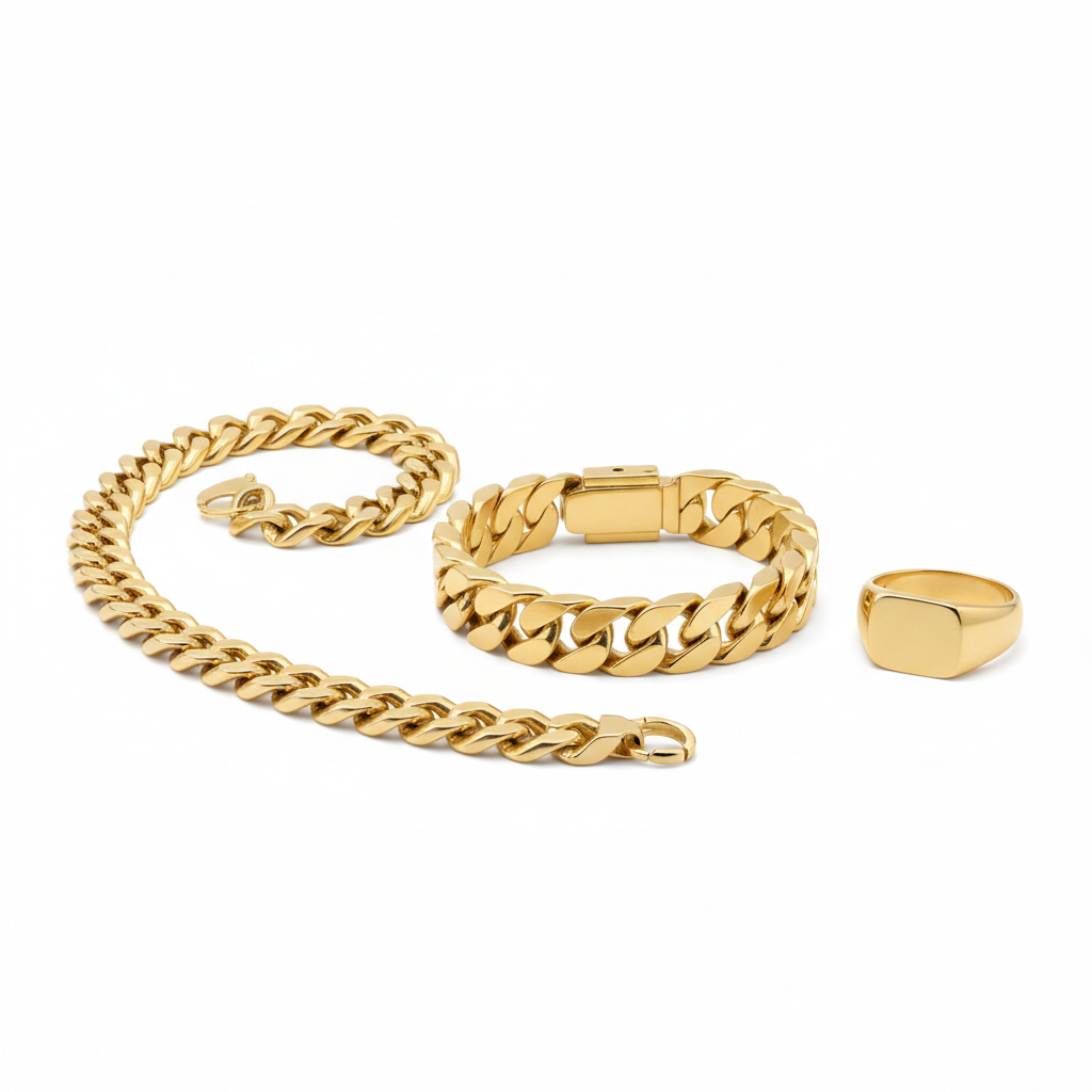 Gold Cuban link bracelet, chain necklace and signet ring on white background